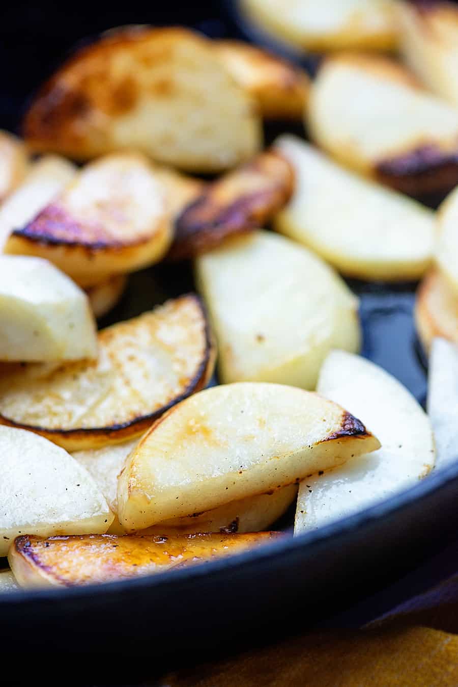 cooked turnips in a black cast iron skillet