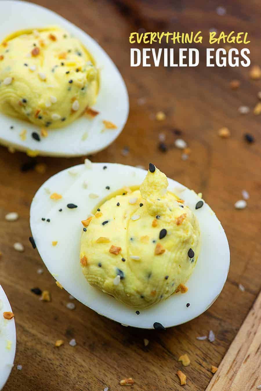 A close up of a deviled egg topped with everything bagel seasoning.