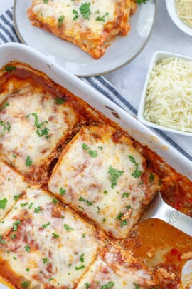 overhead view of lasagna in white pan.
