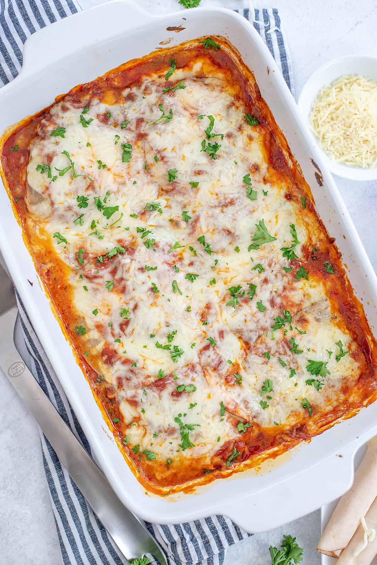 low carb lasagna in white baking dish.