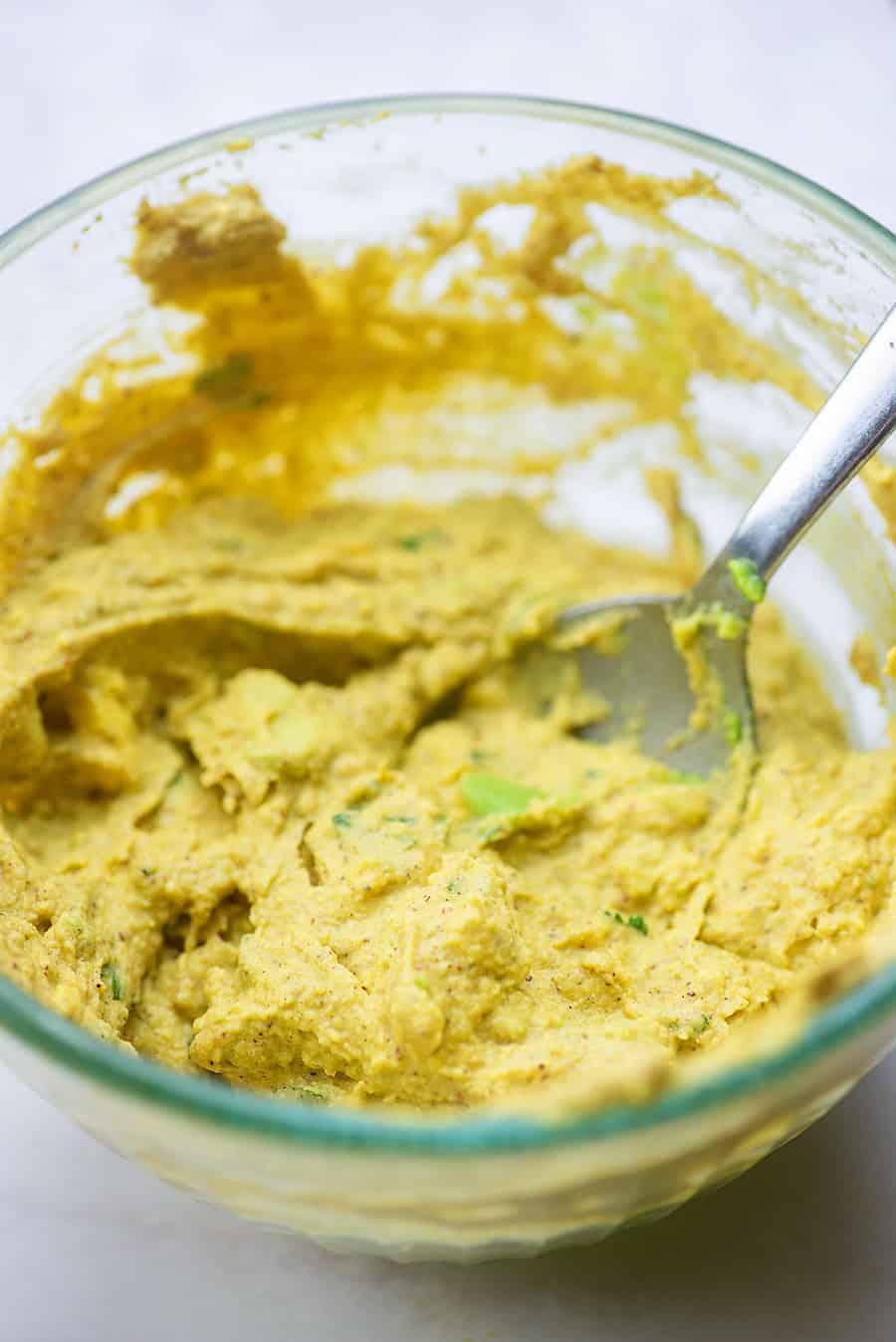 filling for avocado deviled eggs in glass bowl