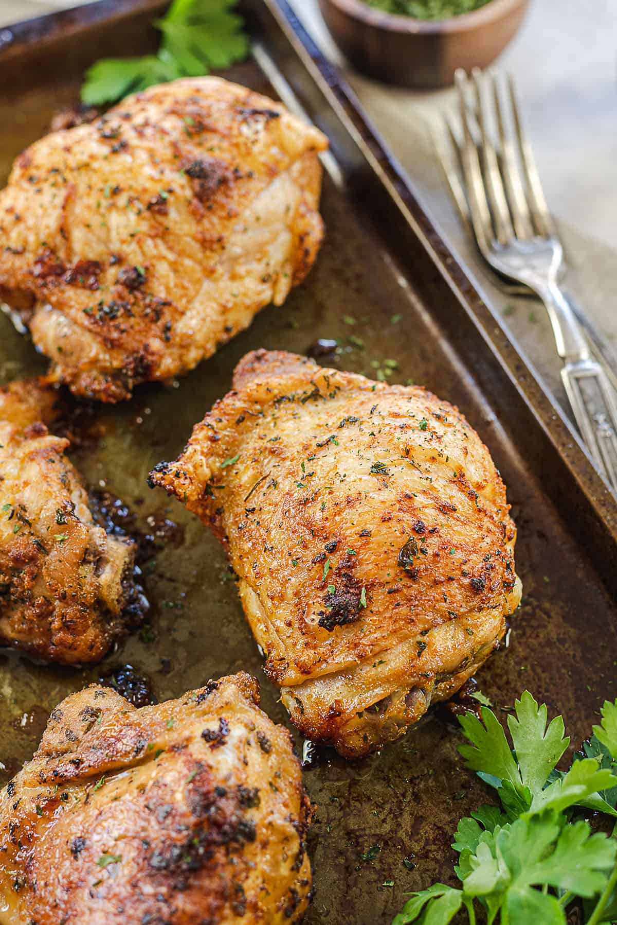 crispy baked chicken thighs on sheet pan.