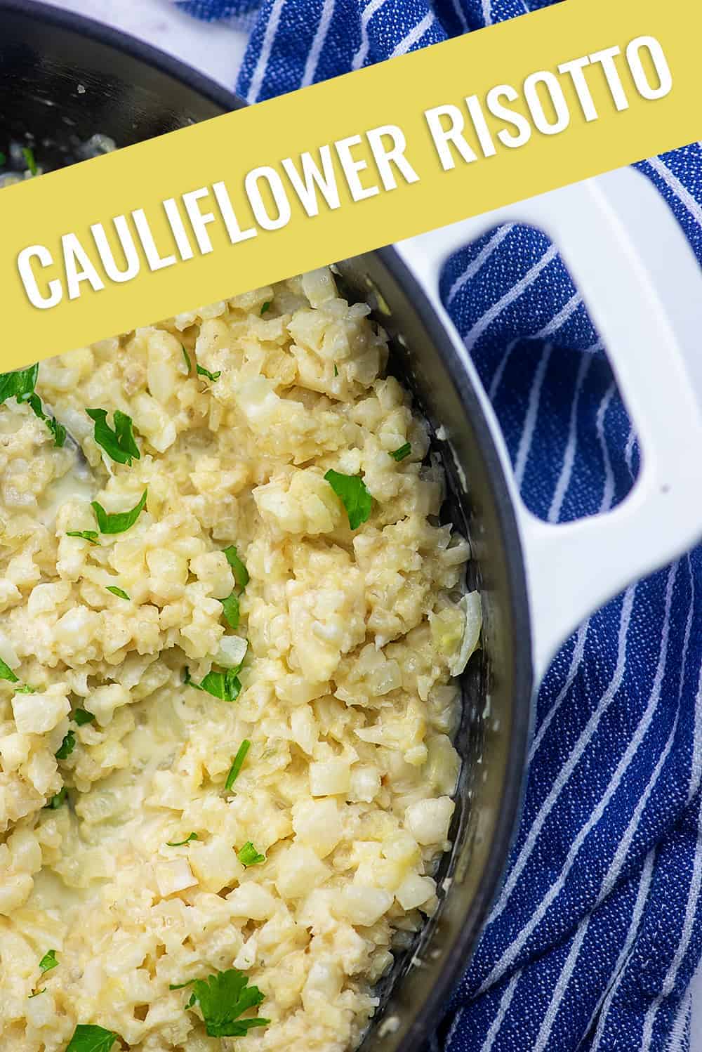 A close up of cauliflower risotto in a white cast iron skillet
