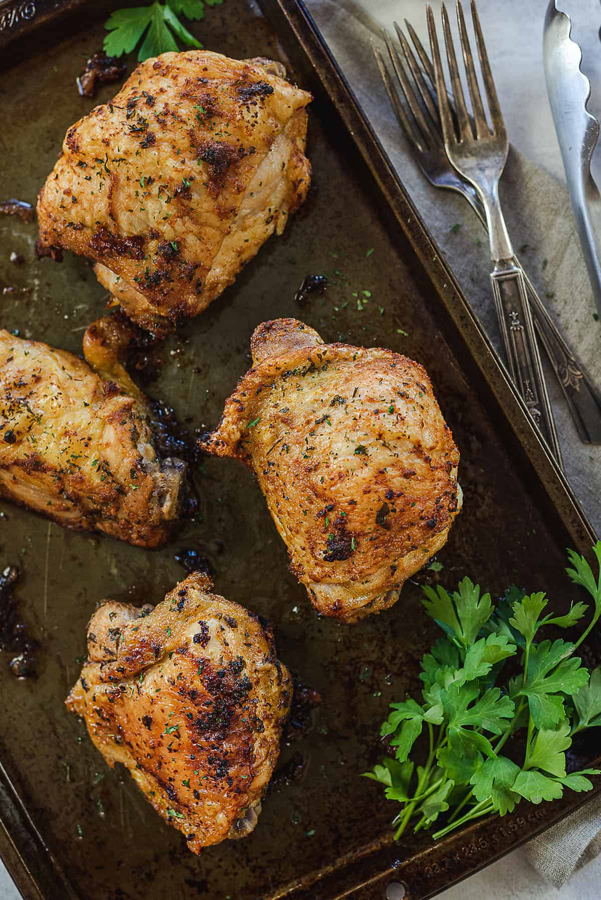 crispy baked chicken thighs on sheet pan.