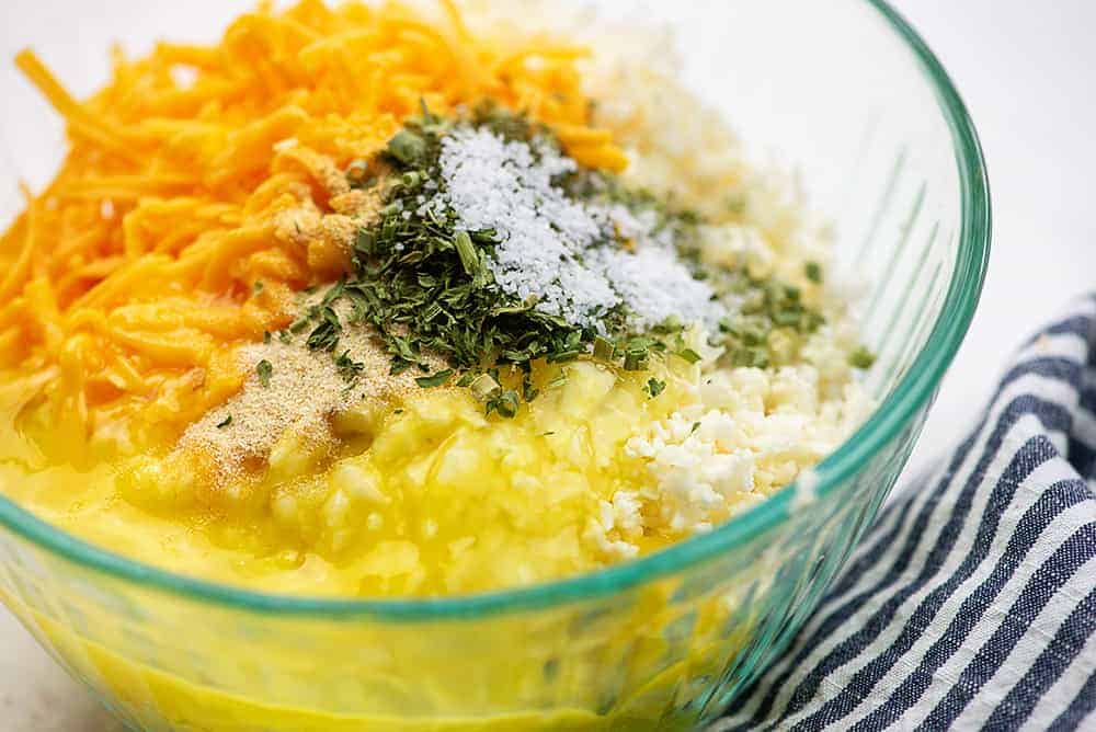 ingredients for cauliflower fritter recipe in glass bowl