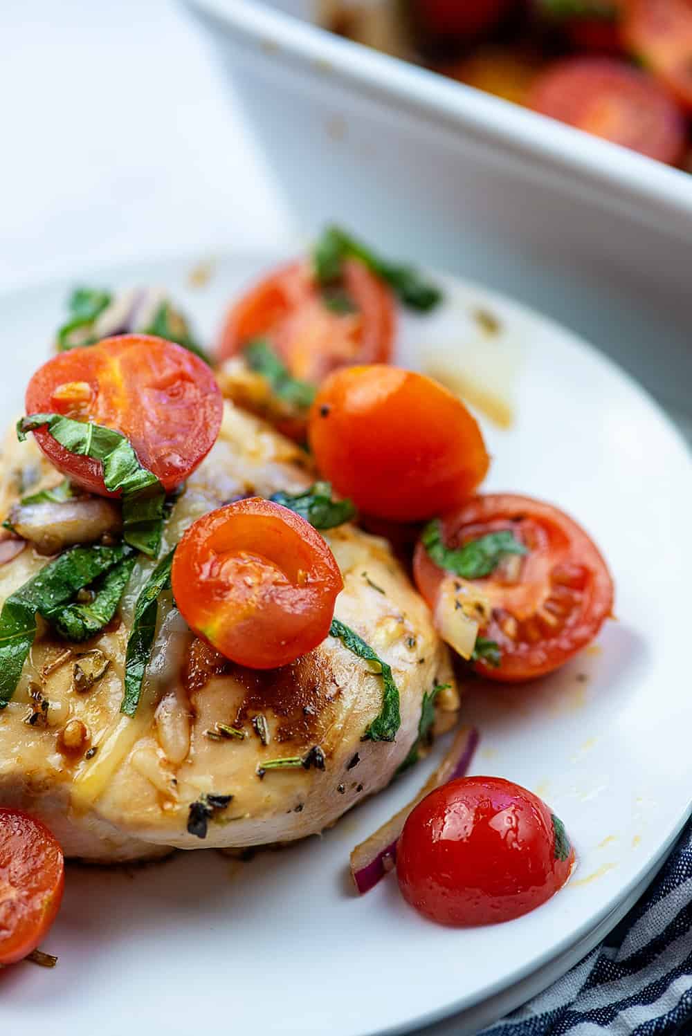 bruschetta chicken on white plate