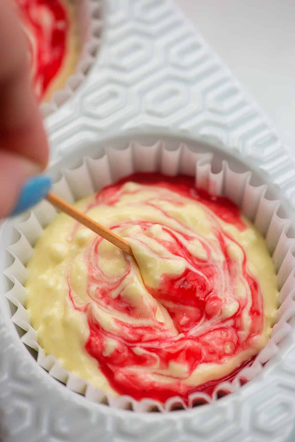 raspberry sauce swirled into cheesecake