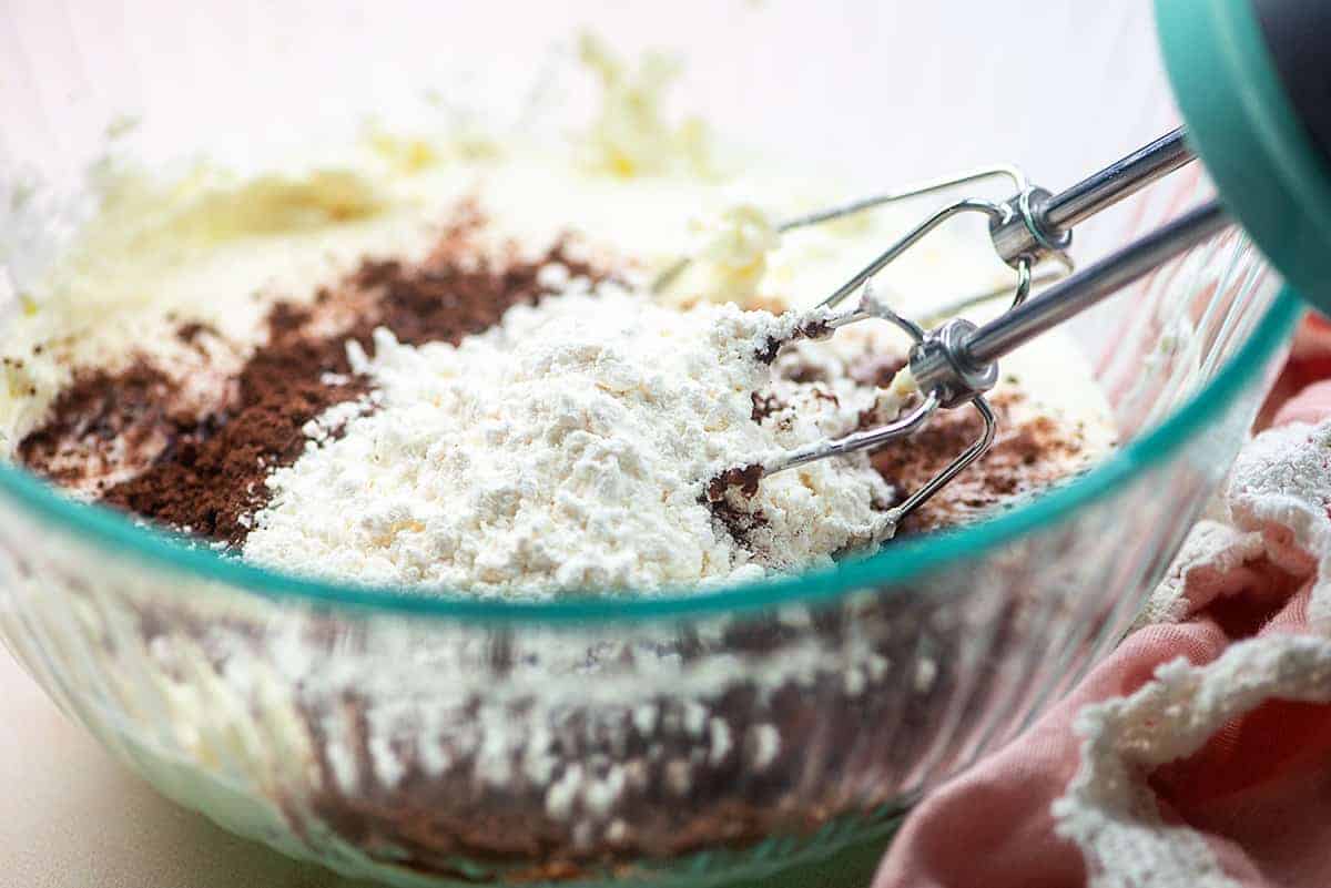 ingredients for easy chocolate mousse in glass bowl with mixer