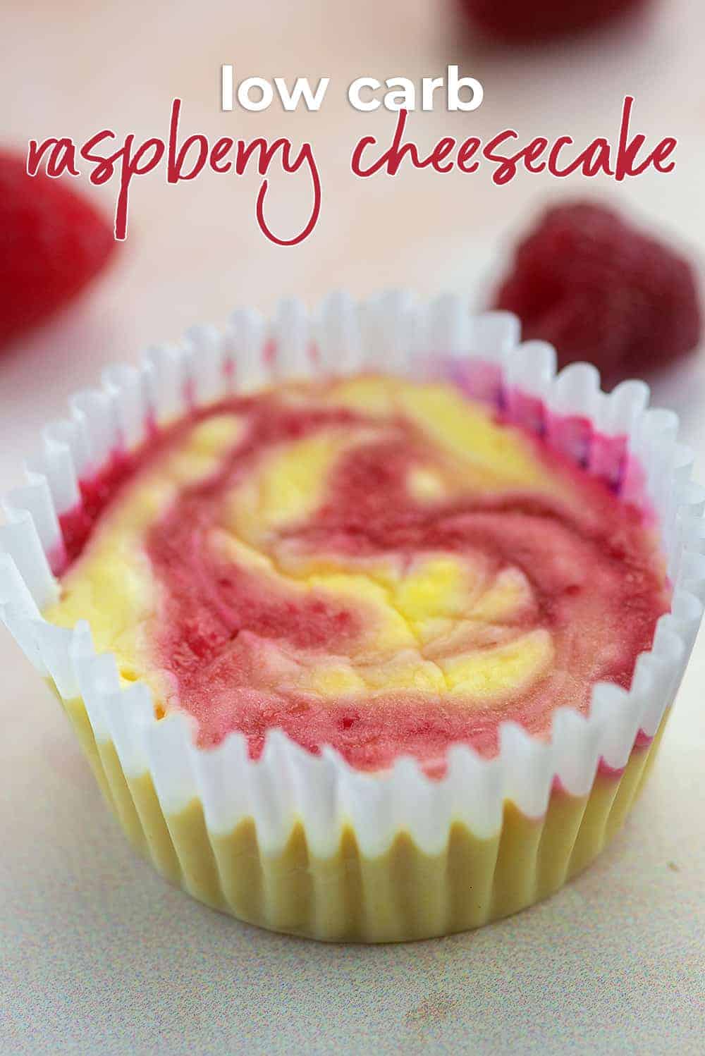 Close up of a raspberry cheesecake in a cupcake wrapper