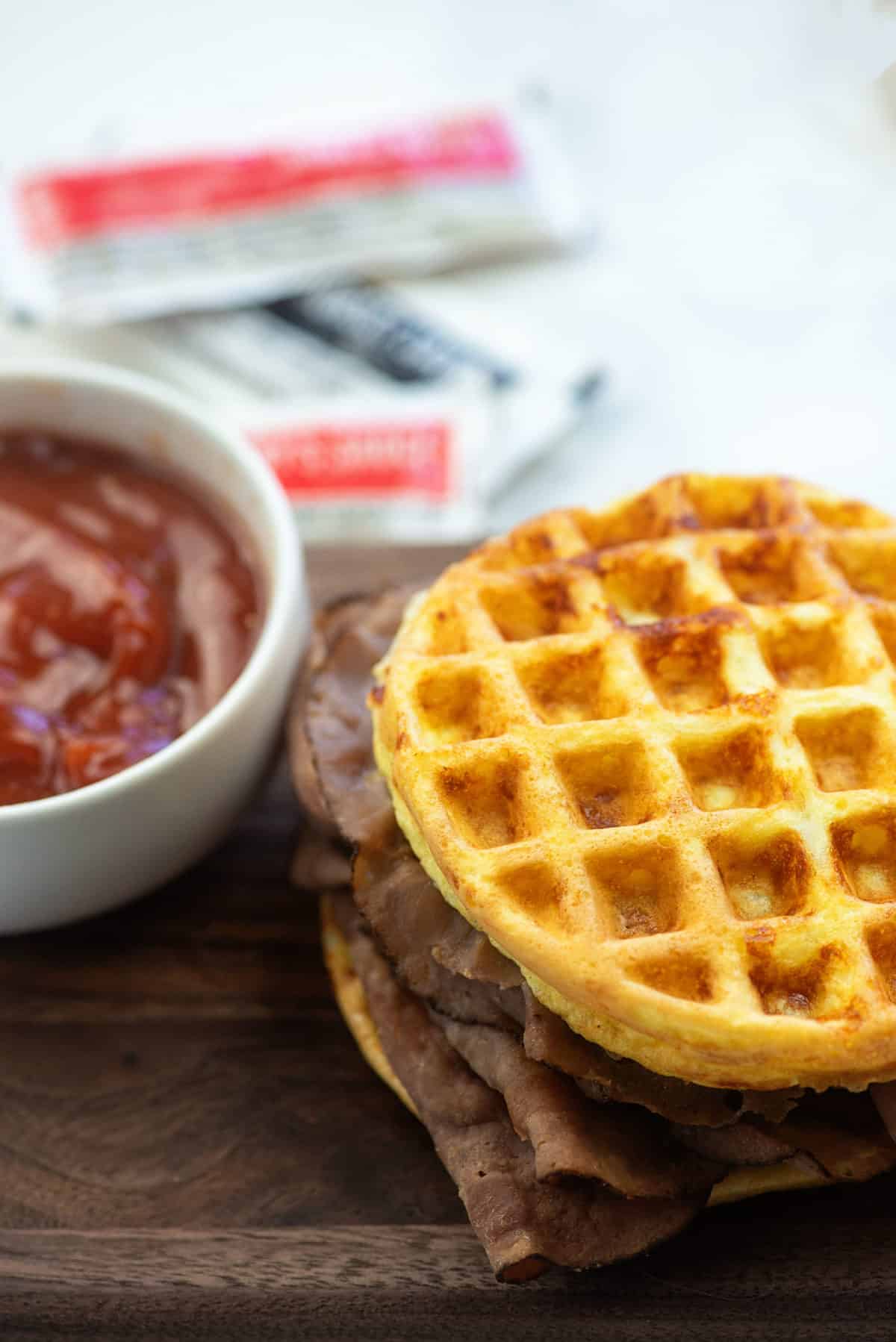 low carb arby's sandwich and sauce on wooden cutting board