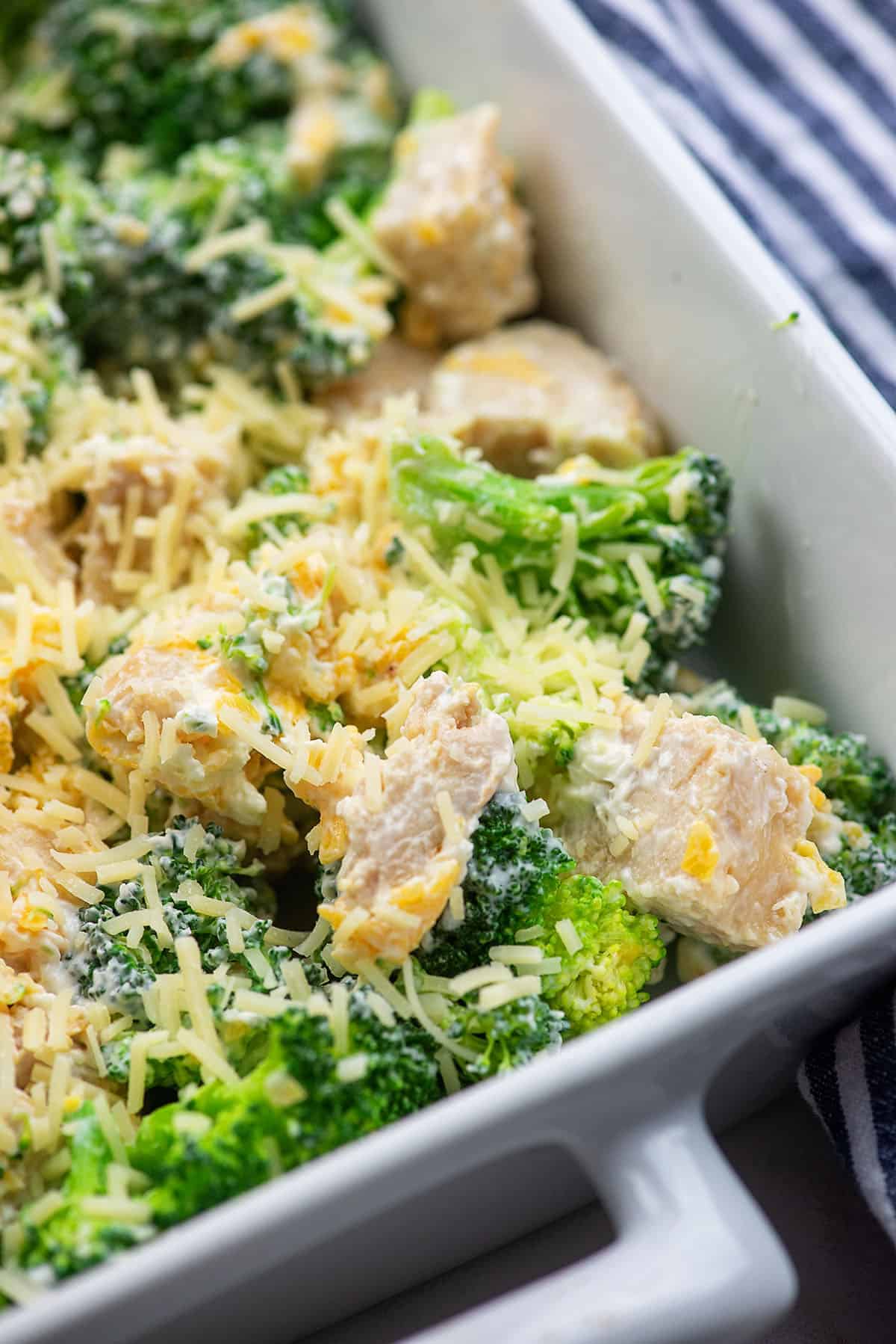 broccoli chicken casserole in white casserole dish