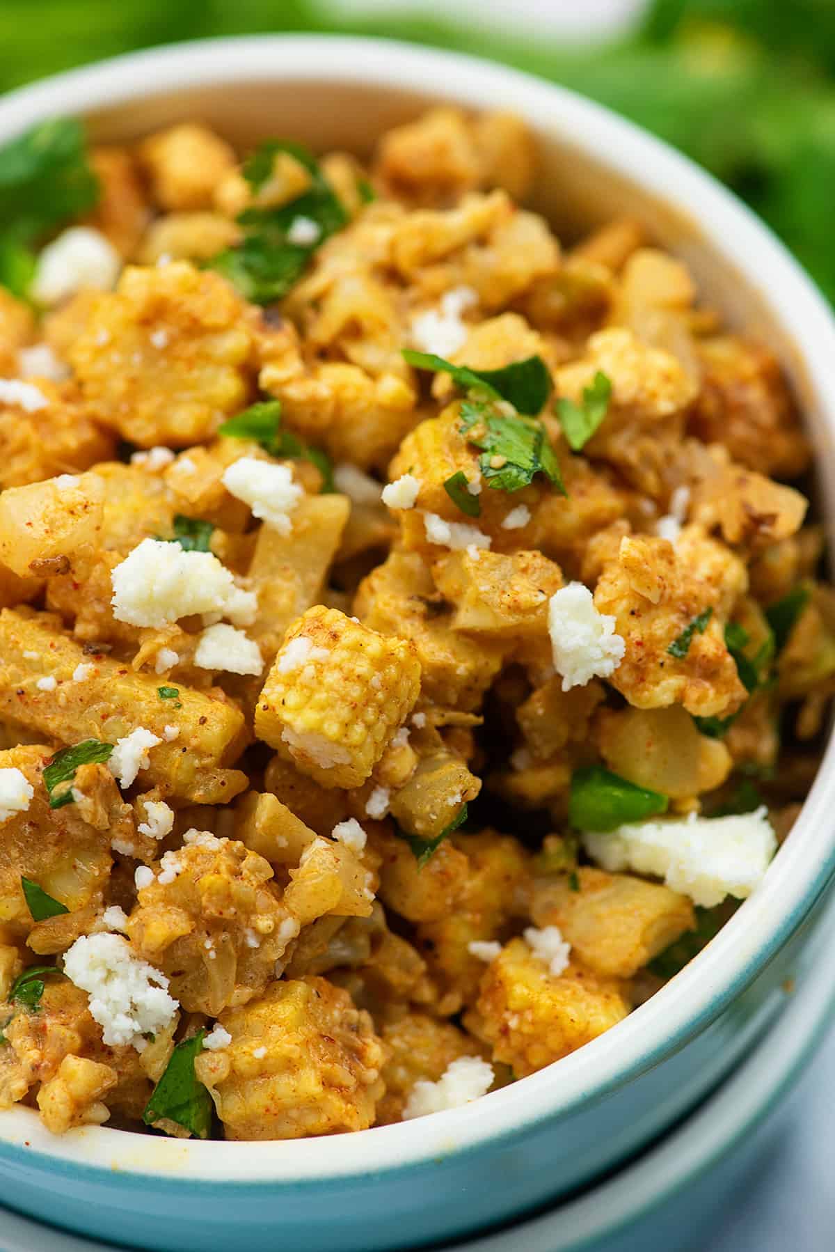 low carb esquites with baby corn in blue bowl