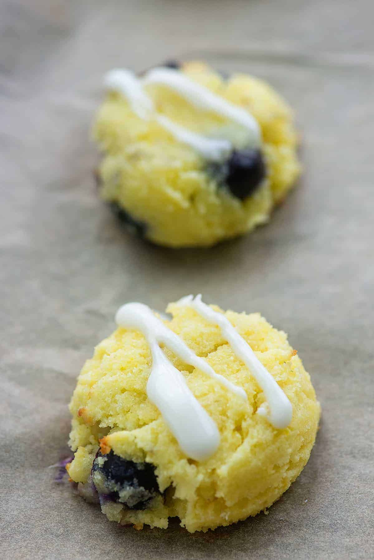 blueberry glazed cookies on baking sheet