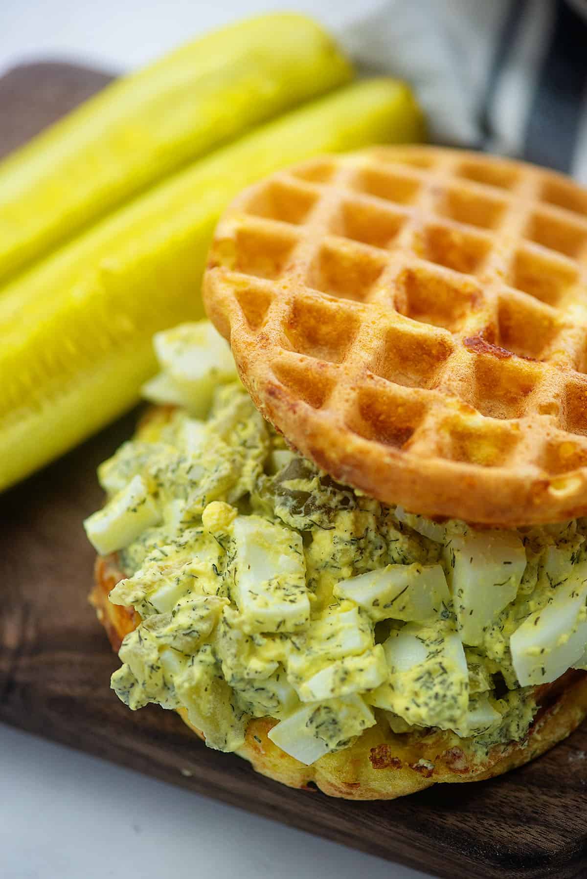 A close up of egg salad on a chaffle.