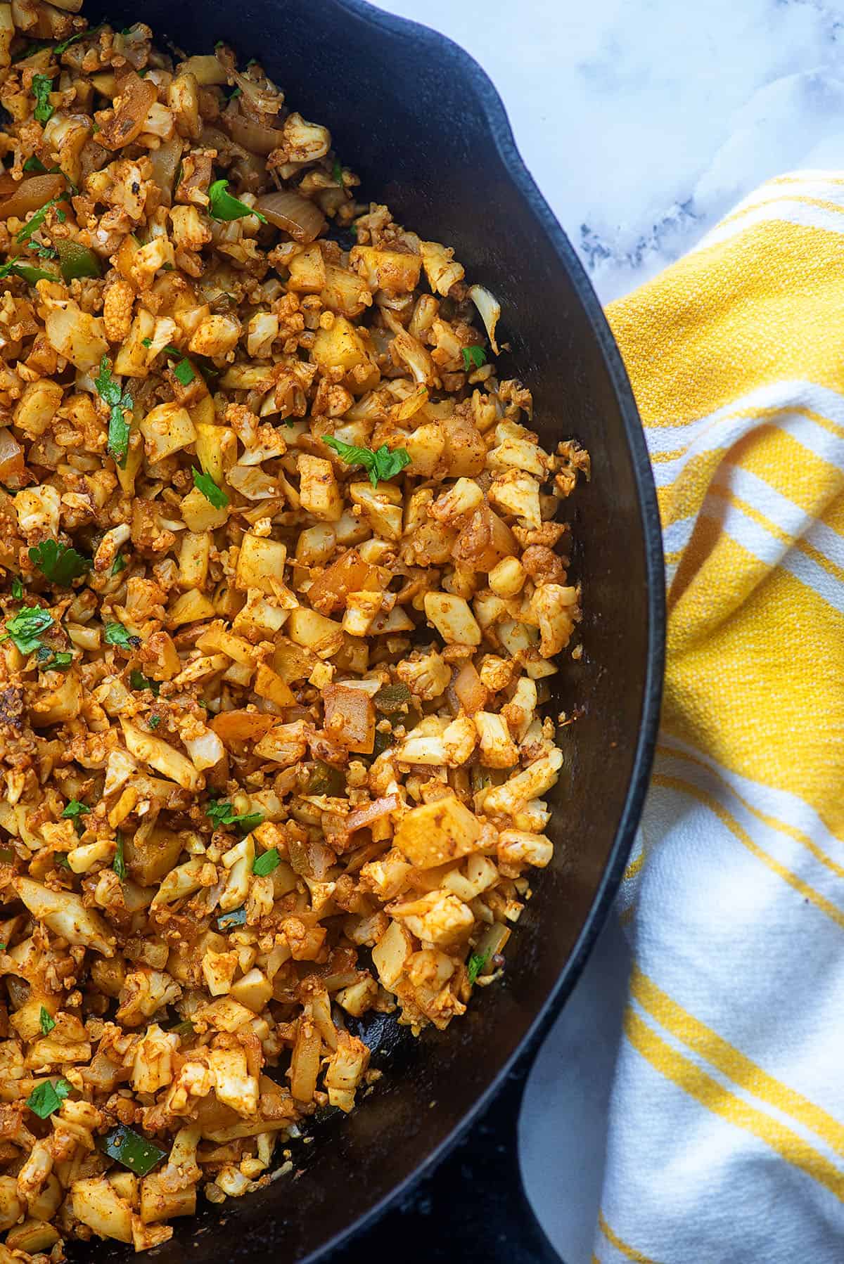 mexican cauli rice recipe in cast iron skillet