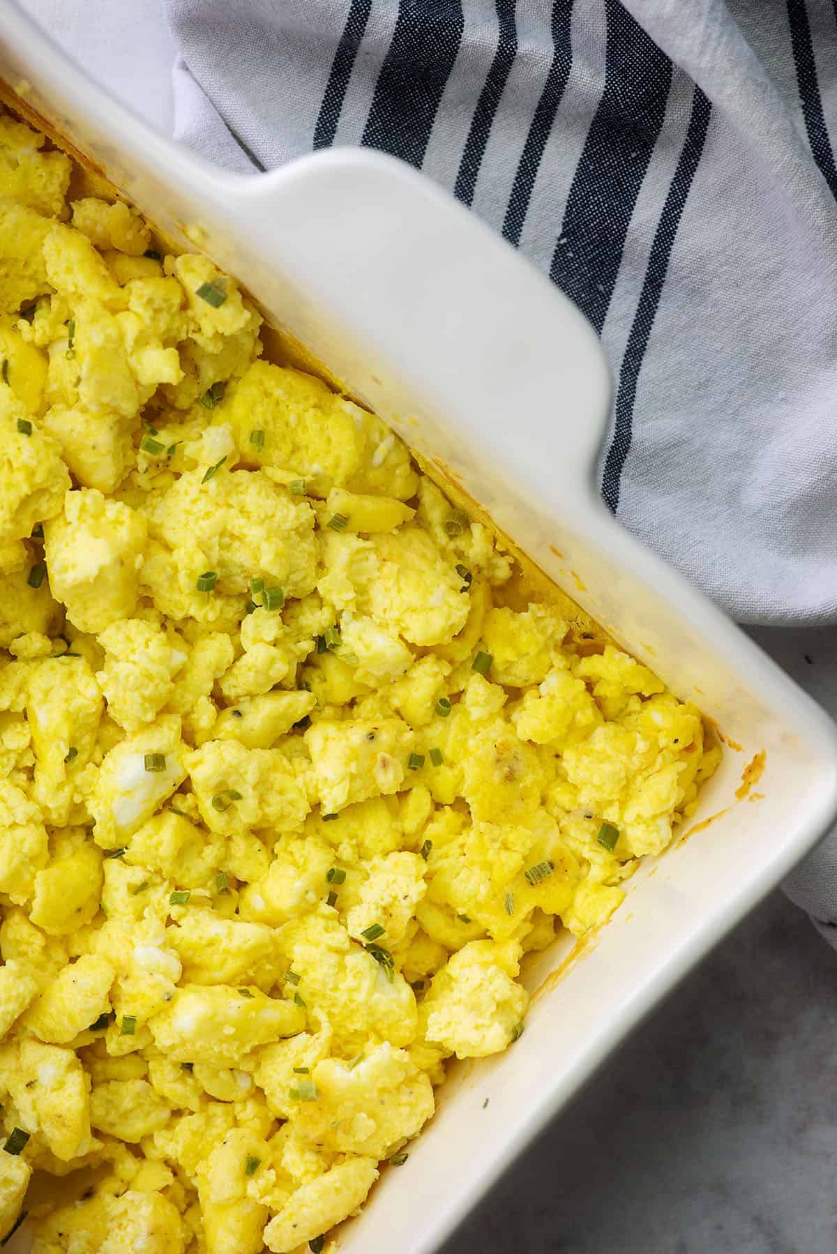 oven baked scrambled eggs in white baking dish