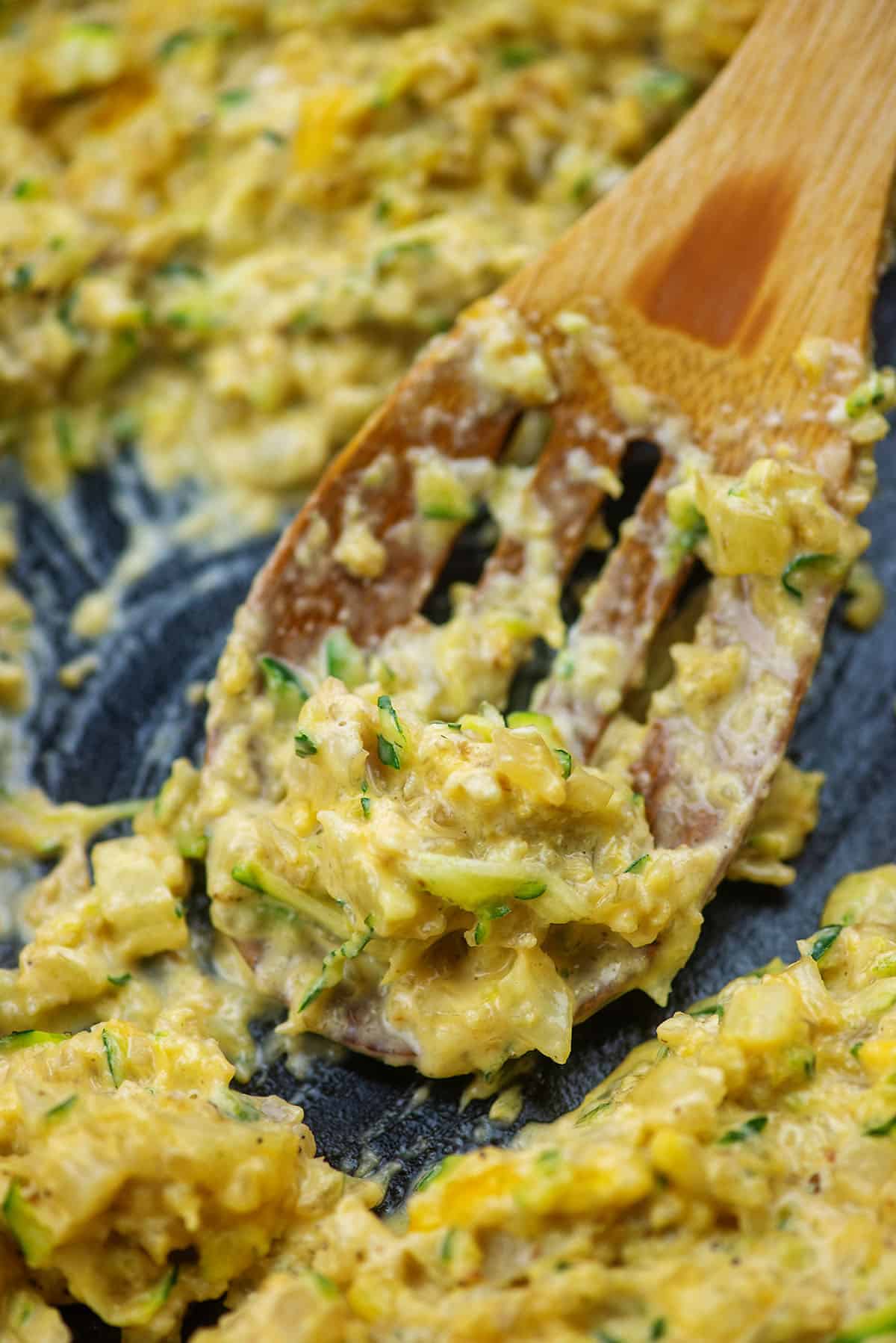 cheesy zucchini cauliflower rice in cast iron skillet