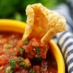 salsa with pork rinds in yellow bowl