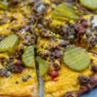 low carb cheeseburger pizza slices on pizza pan