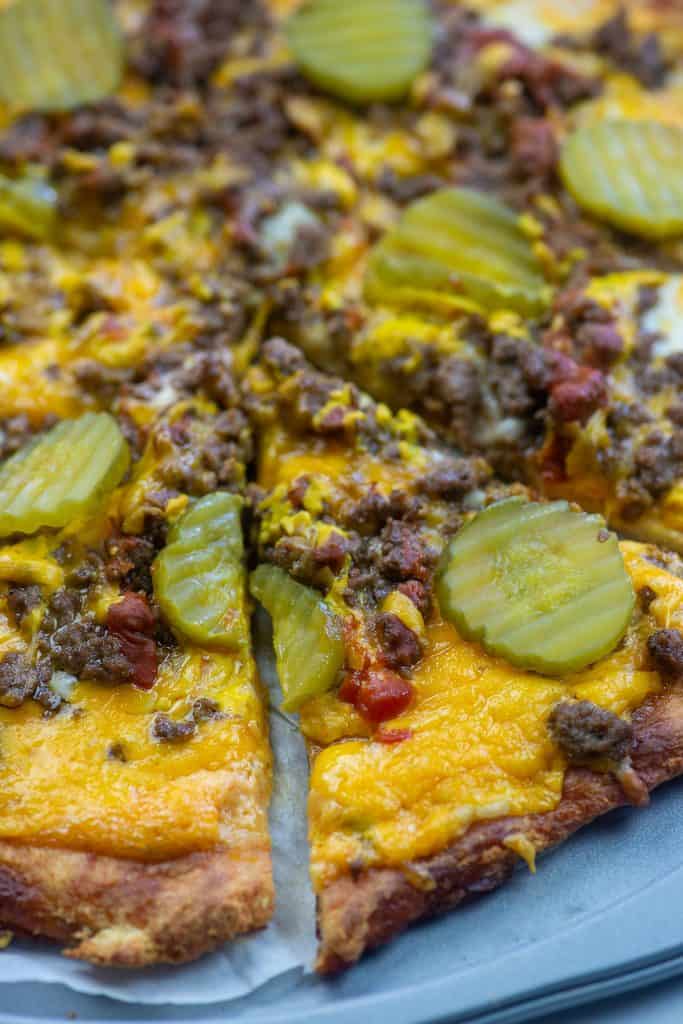 low carb cheeseburger pizza slices on pizza pan