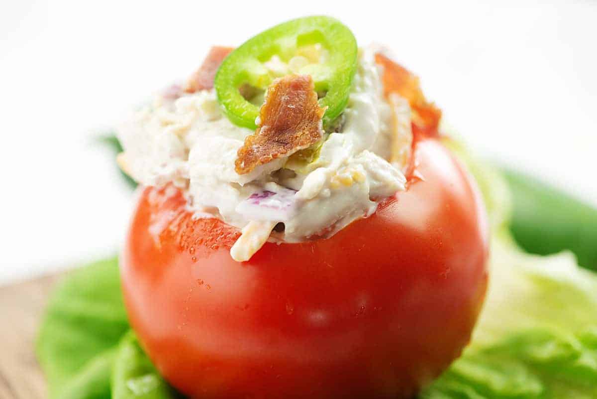 jalapeno popper chicken salad inside a tomato