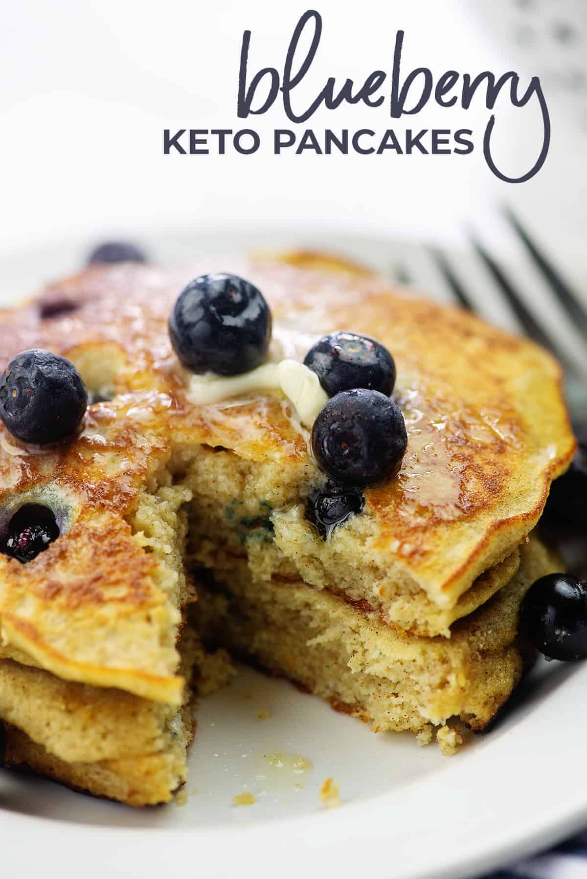 keto blueberry pancakes on white plate with fresh berries