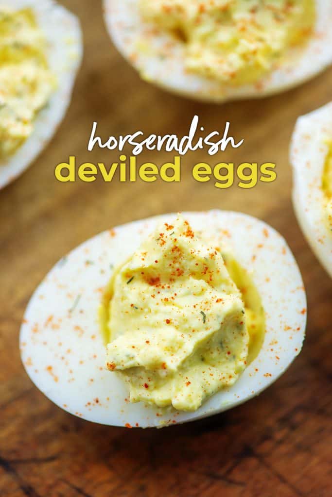 horseradish deviled eggs on wooden cutting board