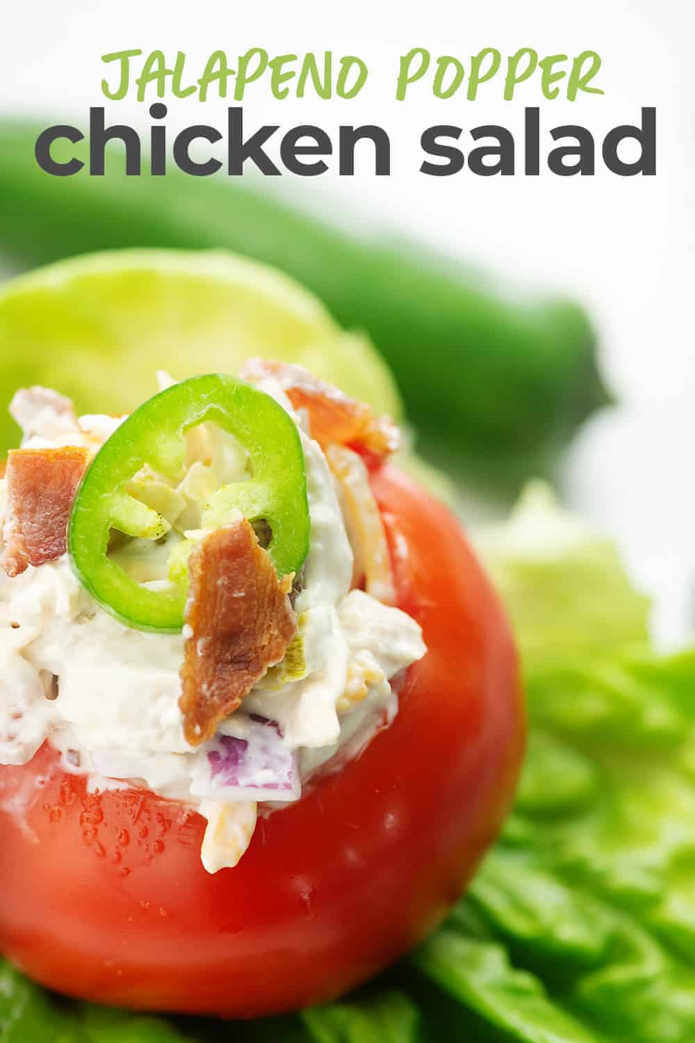 jalapeno popper chicken salad stuffed inside a tomato salad stuffed in tomato