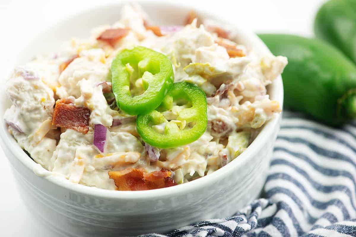 chicken salad with jalapenos and bacon in white bowl