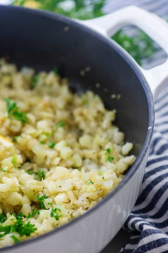 cauliflower rice in white cast iron skillet