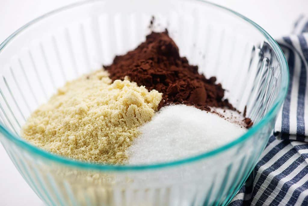 ingredients for keto chocolate pie crust in glass bowl