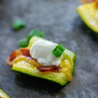 zucchini slices topped with cheese and bacon