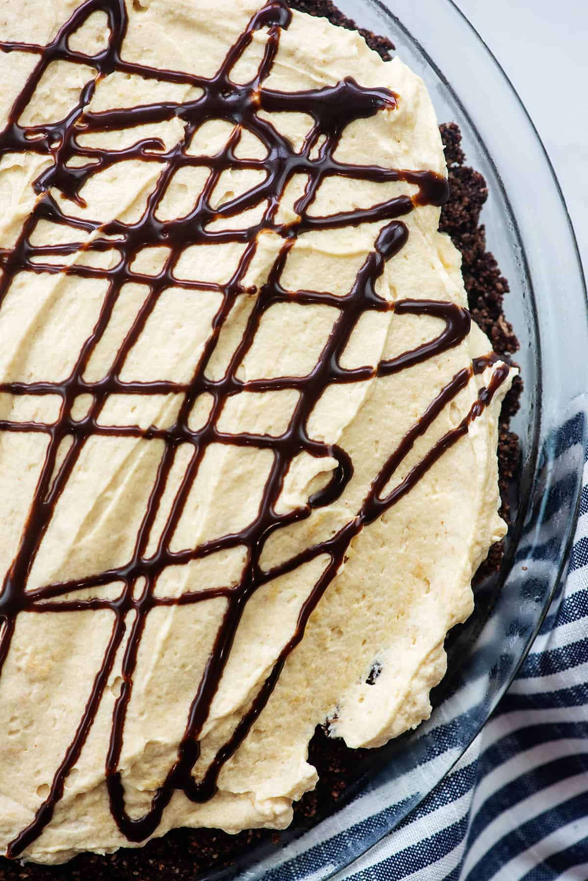 low carb peanut butter pie drizzled with chocolate sauce