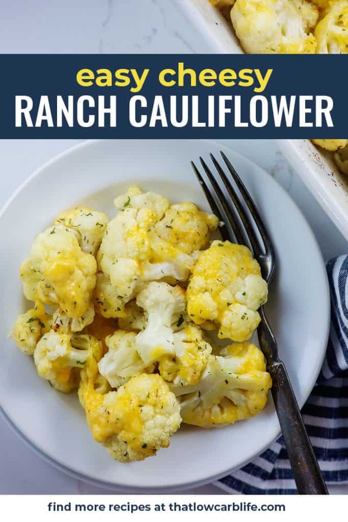 baked cheesy cauliflower on white plate with vintage fork