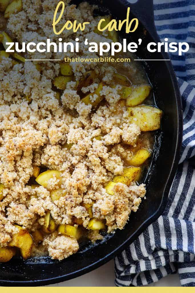 zucchini cobbler in cast iron skillet with blue striped napkin