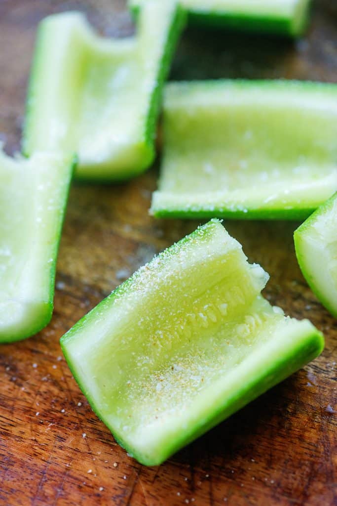 sliced zucchini on wooden cutting board