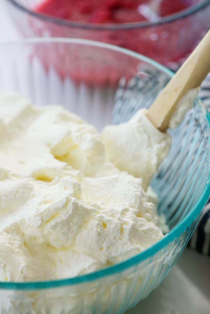 whipped cream in glass bowl