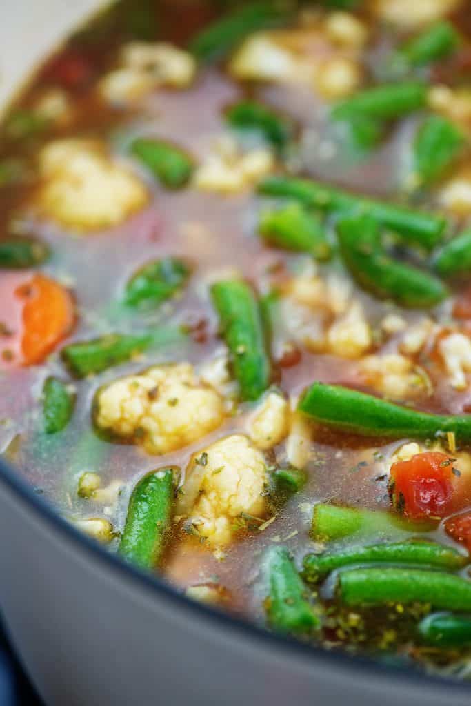 soup pot full of broth and vegetables