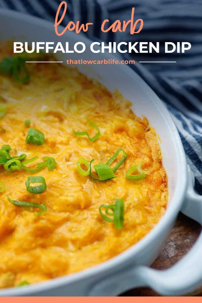 keto buffalo chicken dip in white baking dish topped with green onions