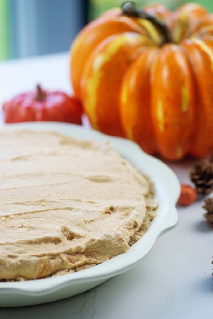 no bake pumpkin pie surrounded by pumpkins