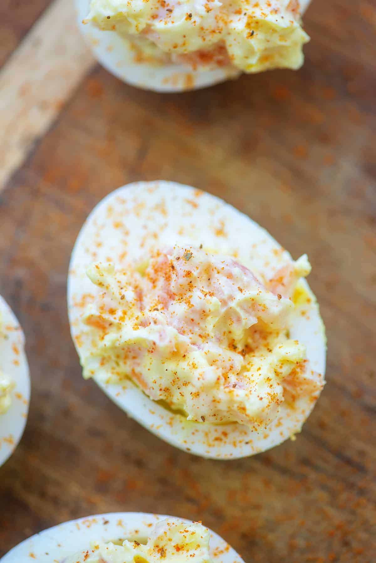 deviled egg with smoked salmon and Old Bay seasoning on top