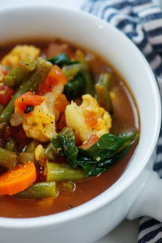 low carb vegetable soup in white bowl