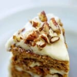 pumpkin layer cake with chopped pecans on top