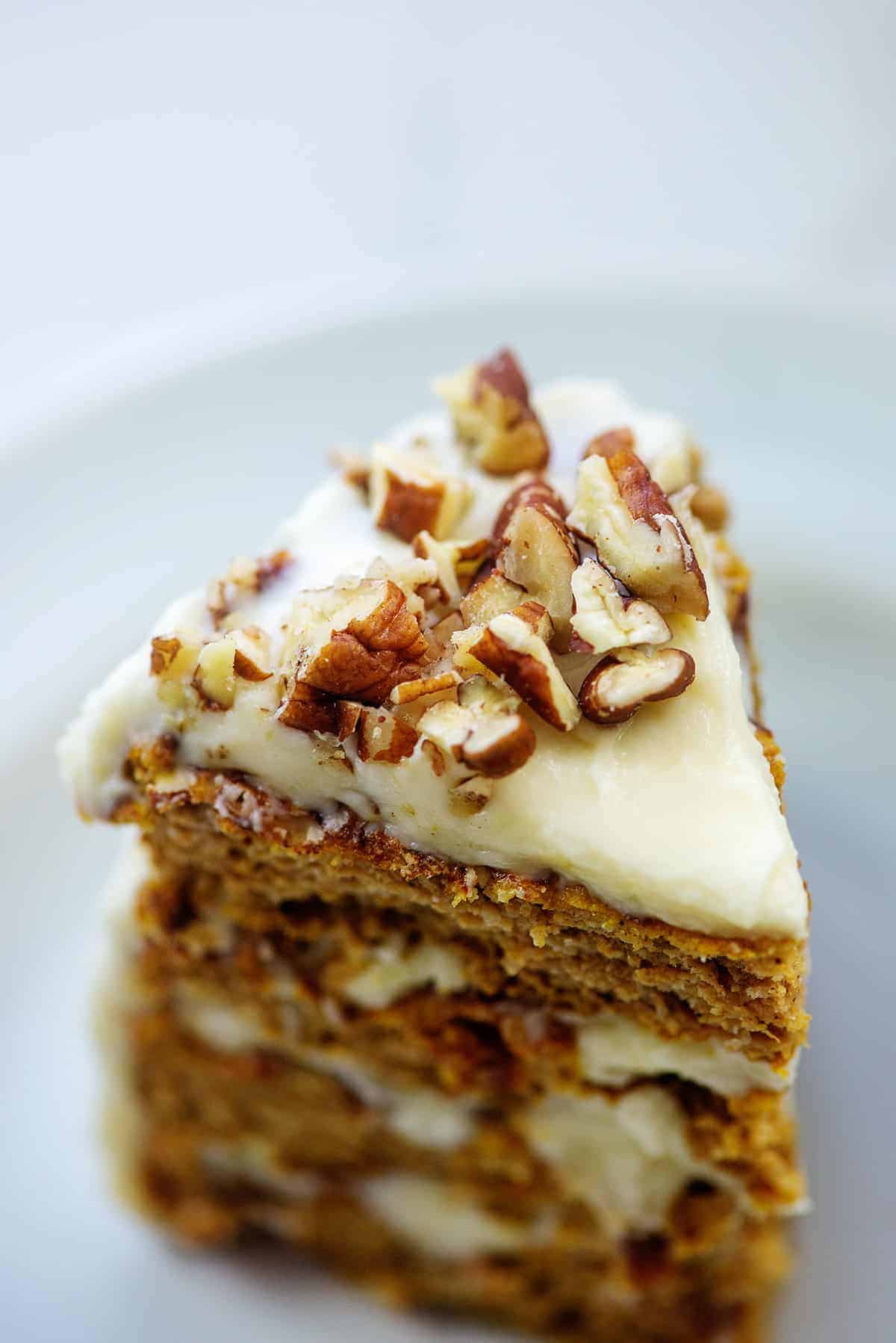 pumpkin layer cake with chopped pecans on top