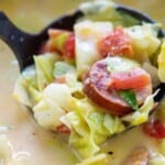cabbage soup with sausage in ladle