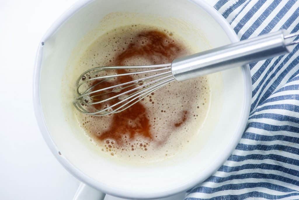 Browned butter in white saucepan. 