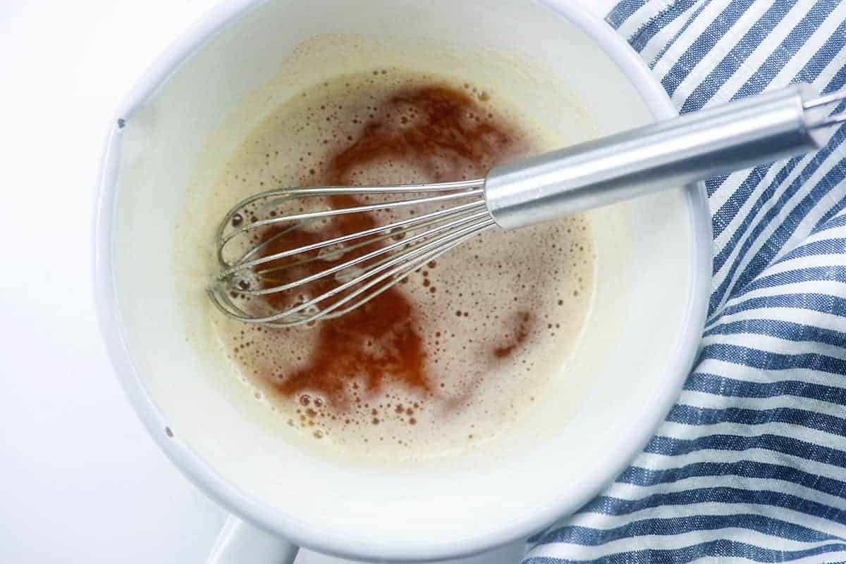 Browned butter in white saucepan.