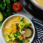 chicken fajita soup in white bowl