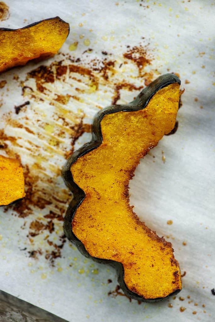 tender roasted acorn squash on baking sheet