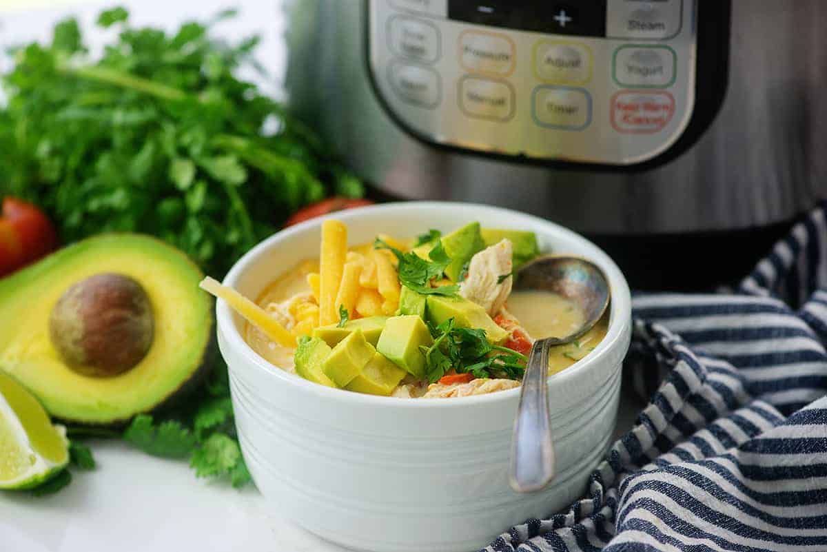 soup in white bowl near an Instant Pot